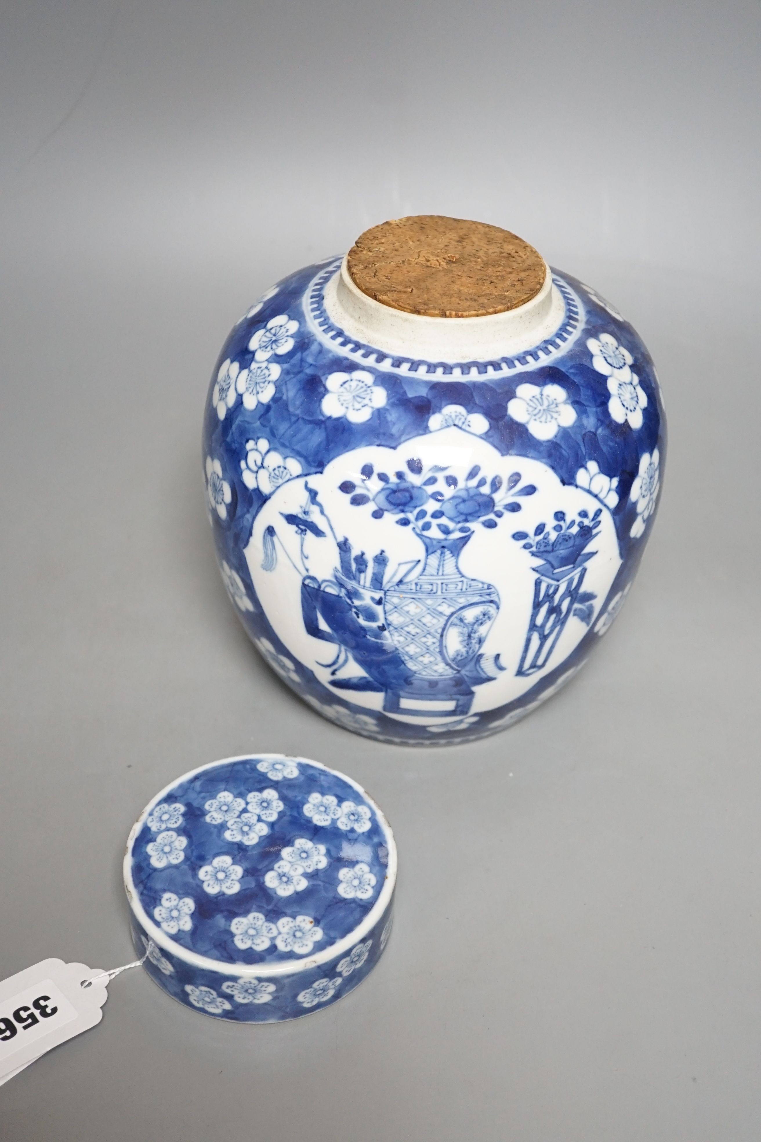 A 19th century Chinese blue and white ginger jar and cover - 20.5cm tall